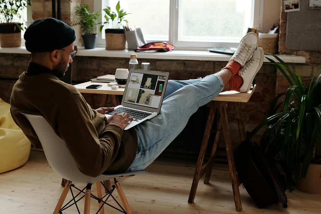Man in Brown Sweater Working from Home